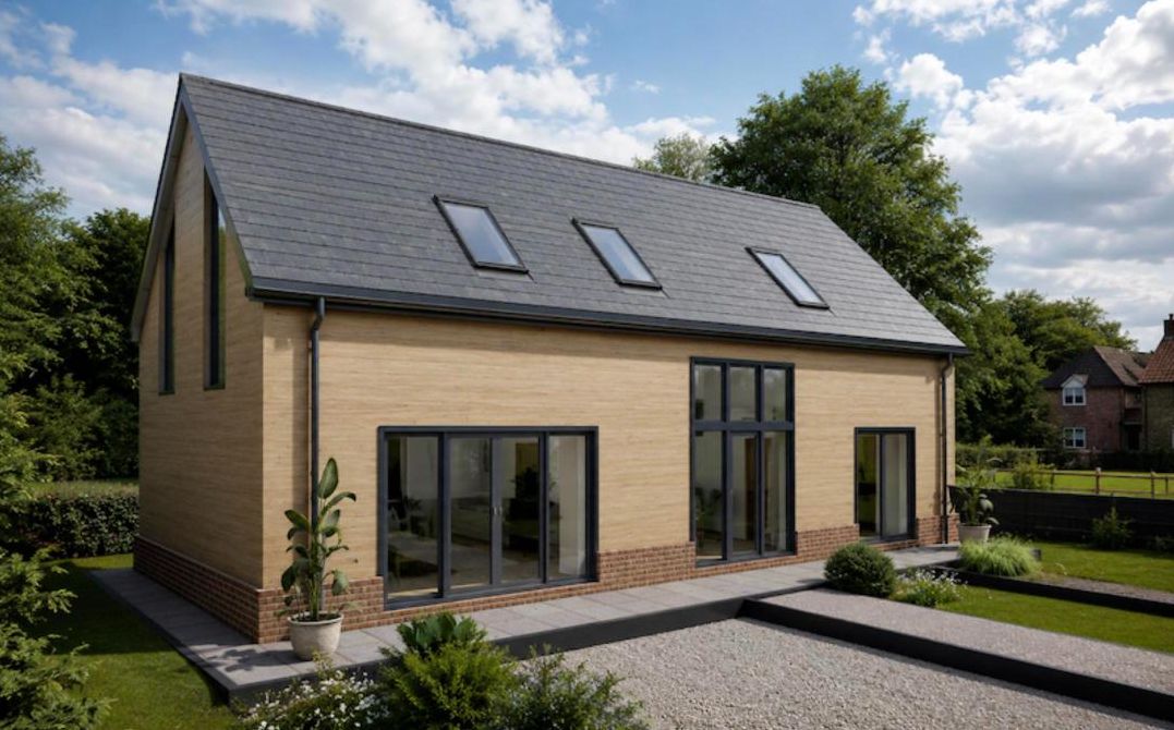 Family home with a slate roof, roof windows and large glazed doors
