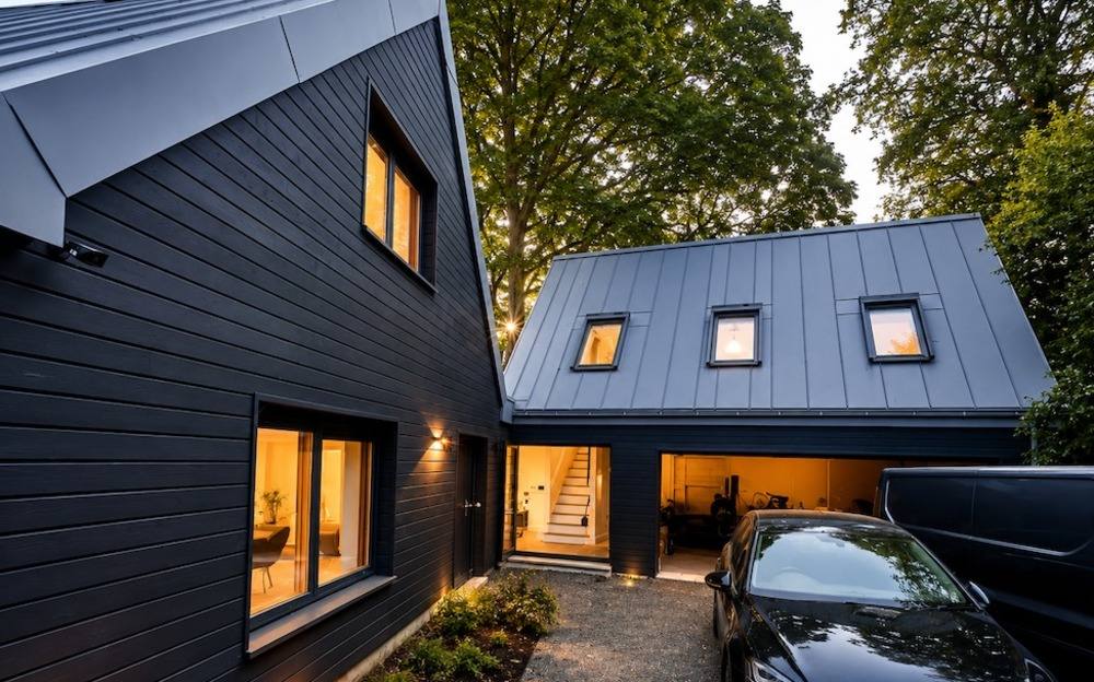 Charcoal-clad home at dusk
